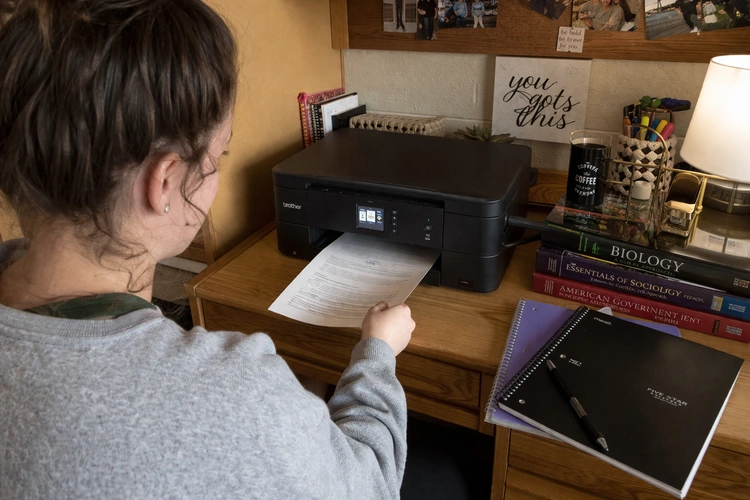 best printer for students sitting on a compact desk in a dorm room