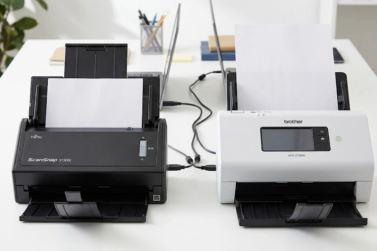 Fujitsu ScanSnap vs Brother scanner side by side on a desk