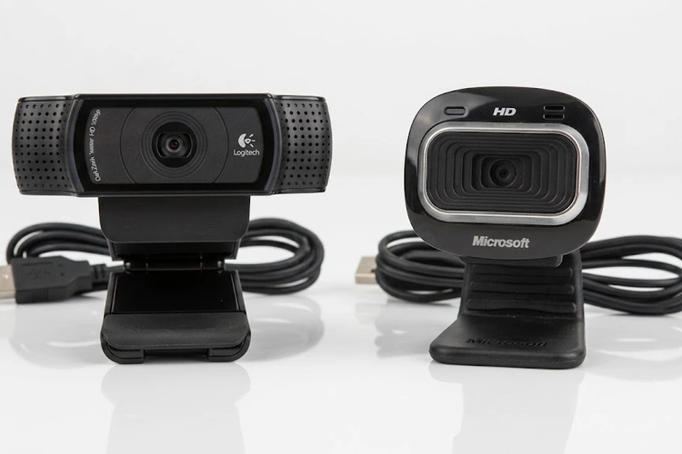 Logitech vs Microsoft webcam side by side on a monitor showing video quality comparison